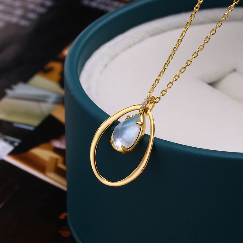 Teardrop Blue Topaz Circle Pendant
